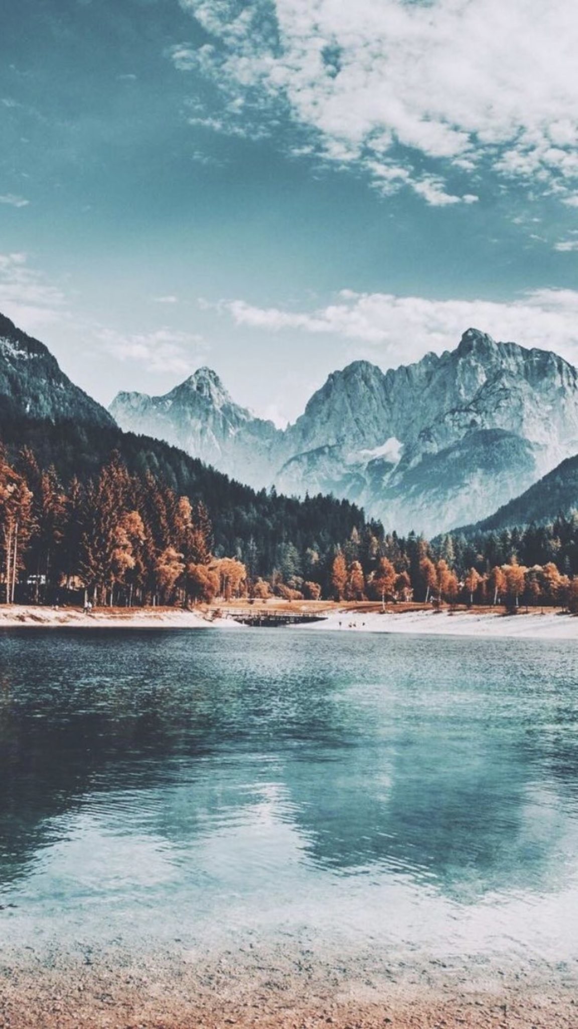 Download Alpine Lake with Mountain Forest Reflection in ultra HD 4K resolution for desktop, iPhone and Android devices.