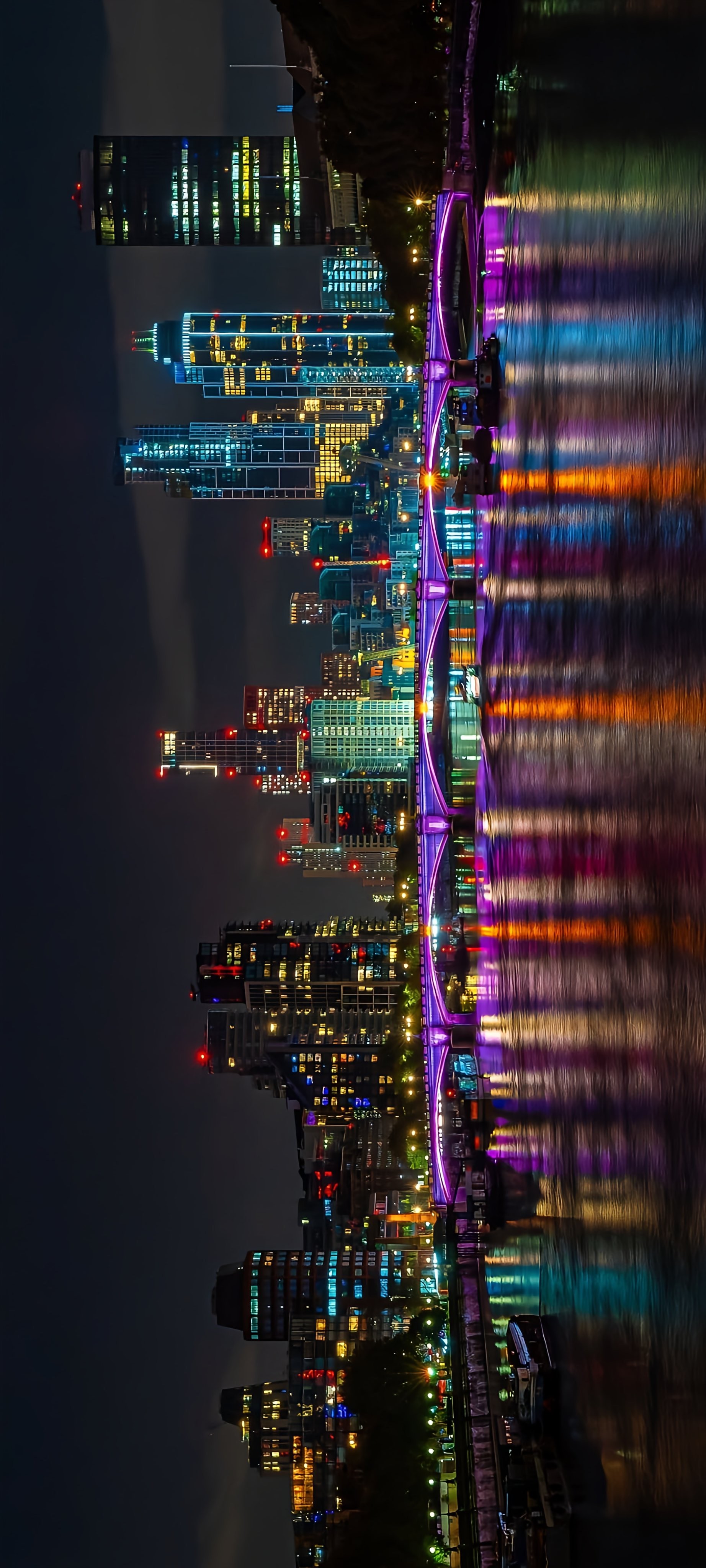 Colorful Bridge and Skyline Over Water
