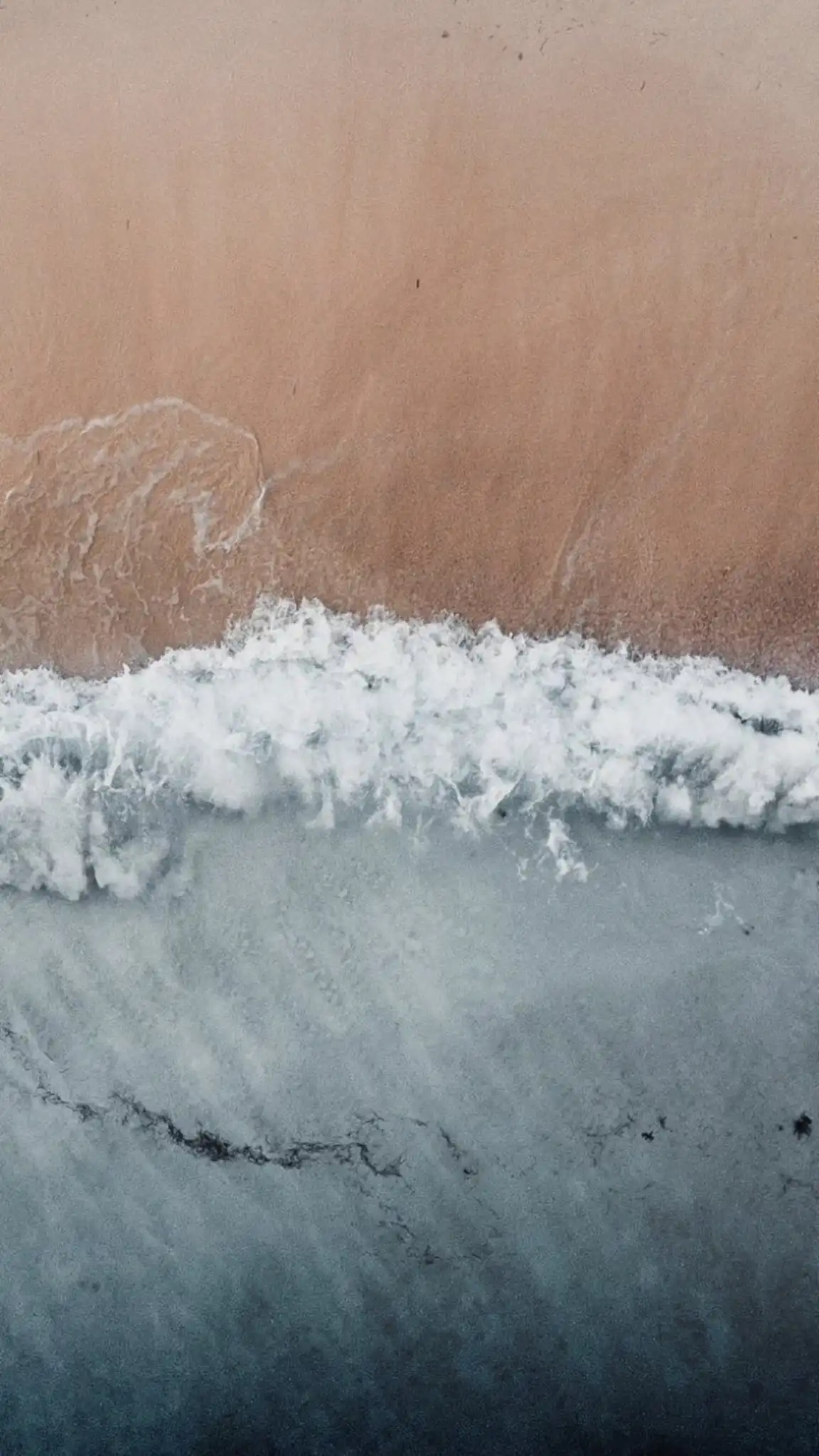 Aerial Ocean Waves Meeting Sandy Beach