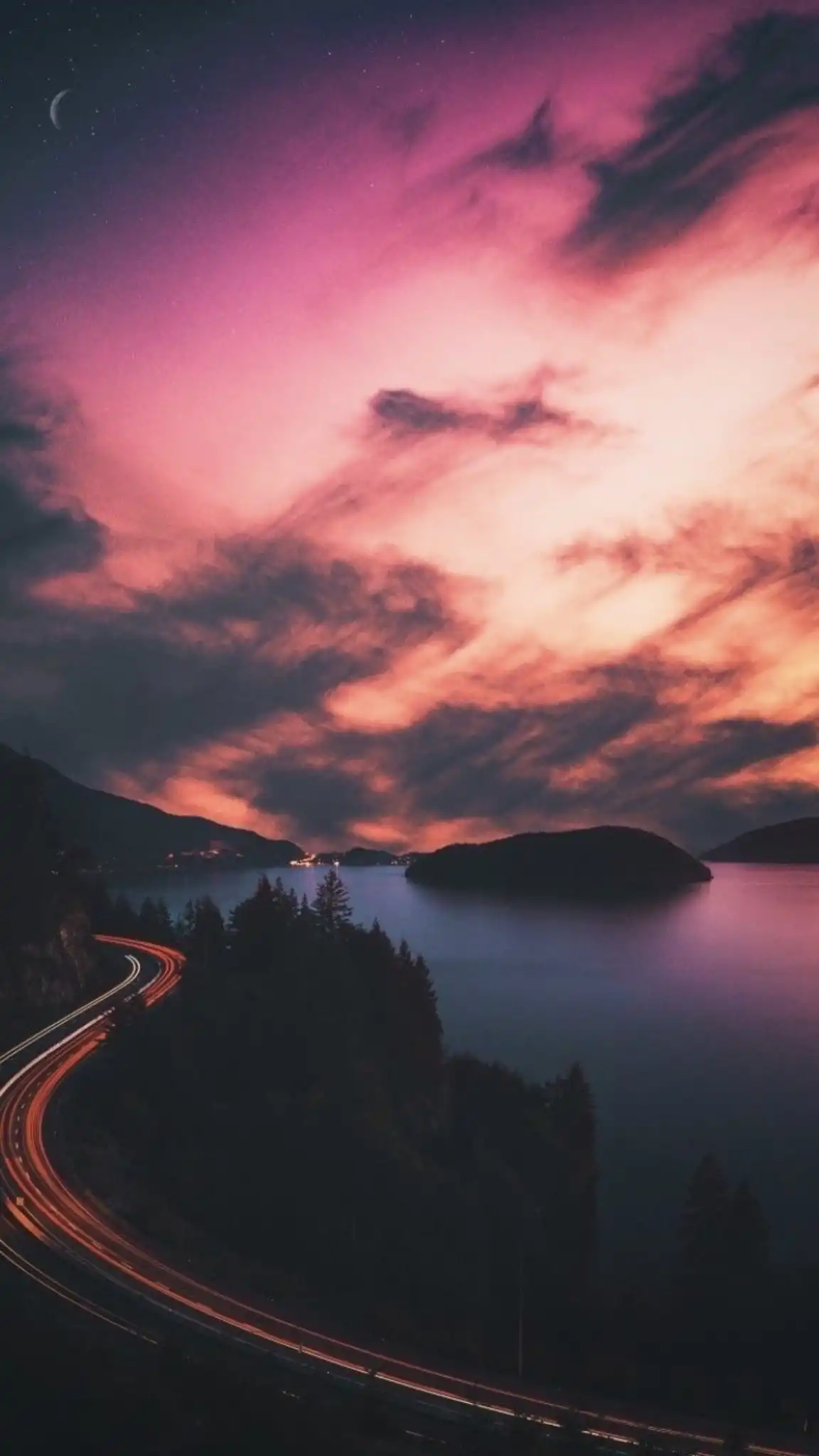 Coastal Road Light Trails Under Purple Sunset Sky