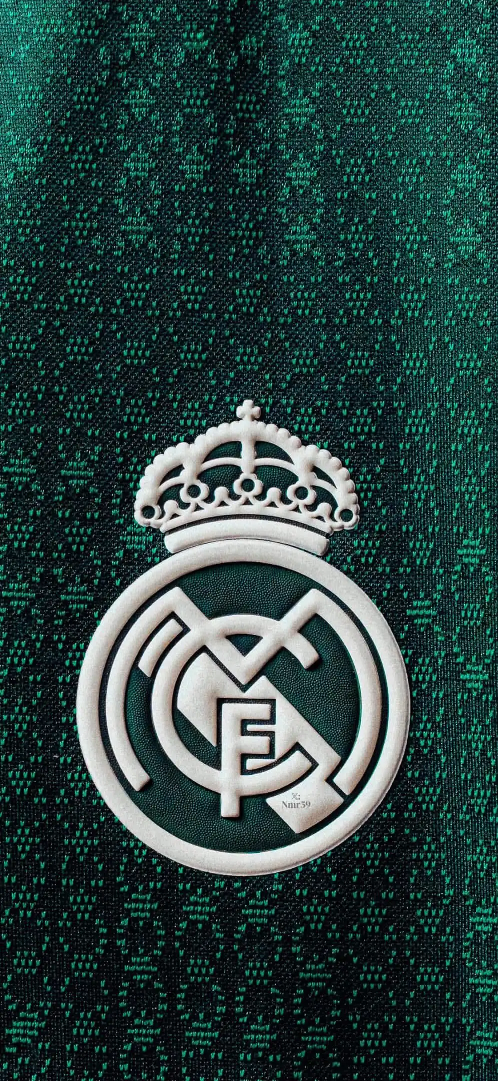 Real Madrid Crest on Green Jersey Texture